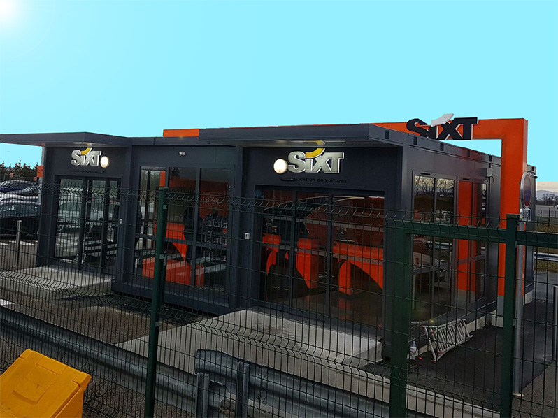 Enseigne et habillage complet de l'agence de location Sixt réalisés par JMJ Com à Lyon